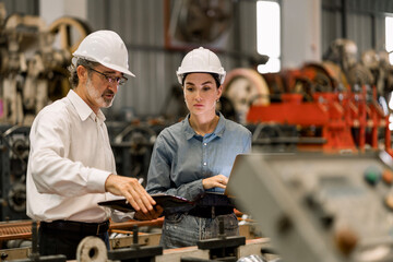 professional engineer,worker,technician use clipboard discuss work, walk in steel metal manufacture 