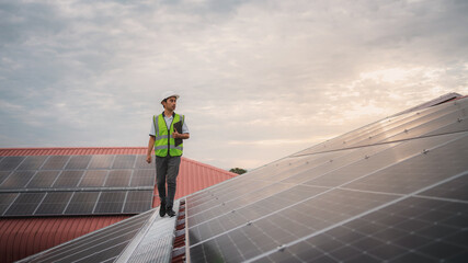 Wall Mural - a service engineer checks a solar cell that is mounted on the roof to see if there is a damaged comp