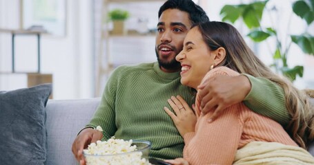 Poster - Couple, home and watching tv with horror movie on sofa, scared and shock with popcorn, hug and relax. Man, woman and lounge couch for streaming scary movies, wow and surprise for show on television