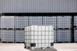 white IBC containers with the factory background.