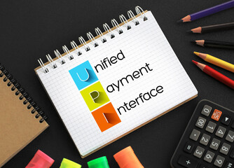 Poster - upi - unified payment interface acronym on notepad, business concept background