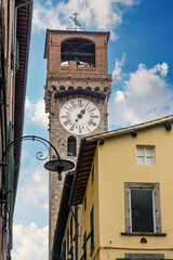 Wall Mural - Lucca, Italy , wiew of the Torre Delle Ore (closk tower) n the old town