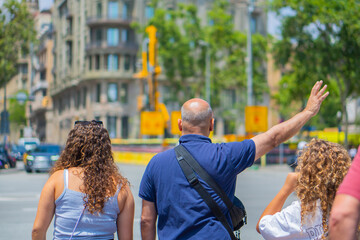 Senior Man Calling a Taxi on the street in Barcelona