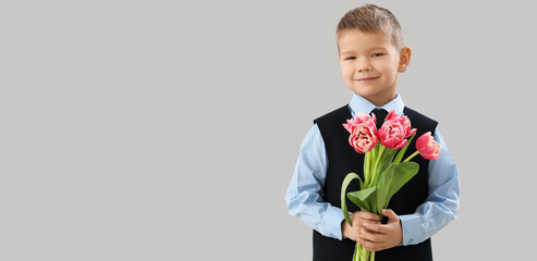 Canvas Print - Cute little boy with bouquet of fresh tulips on grey background with space for text