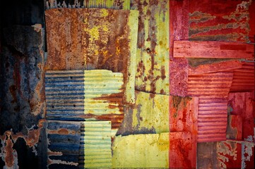 Wall Mural - Abstract background of the flag of Belgium painted on rusty corrugated iron sheets