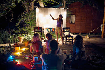 Wall Mural - Friends have fun together on a summer night