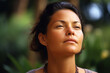© Leon Waltz - Medium shot portrait photography of a woman in her 30s practicing mindfulness sophrology relaxation & stress-reduction wearing a cozy sweater against a hawaiian or polynesian background