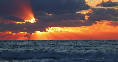 Wall Mural - Beautiful ocean beach sunrise with shining sunrays, scenic clouds over tropical island