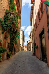 Wall Mural - Street in historical center of Arezzo with facade of medieval buildings. Tuscany, Italy