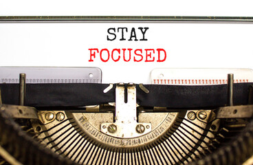 Stay focused symbol. Concept words Stay focused typed on beautiful old retro typewriter. Beautiful white background. Business, support, motivation, psychological and stay focused concept. Copy space.
