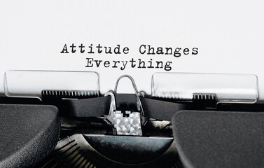 Fototapete - Text Attitude Changes Everything typed on retro typewriter