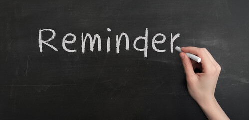 Aufkleber - A woman's hand write text reminder with chalk on chalkboard
