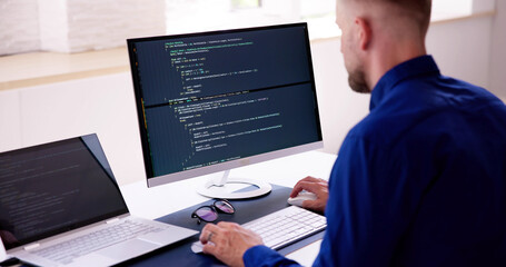 Fototapete - Computer Programmer Writing Program Code On Computer