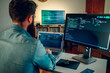 © Zamrznuti tonovi - Rear view of a full-stack developer typing code on his laptop at the home office.