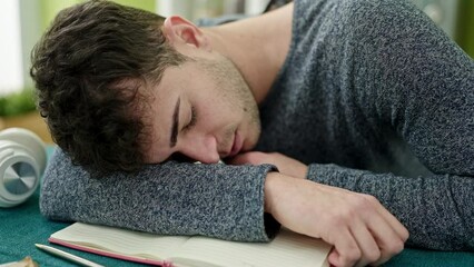 Sticker - Young hispanic man student sleeping on the table at dinning room