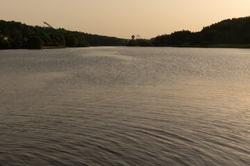 Evening landscape, sunrise or sunset on the lake or the sea