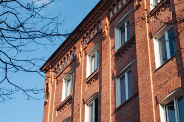 Modern apartment building for residential living in red brick stone