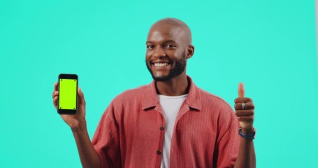 Poster - Green screen, phone and man thumbs up for success, yes and vote, like or emoji with face of winner. Mobile mockup, tracking marker and african person winning or ok hands isolated on studio background