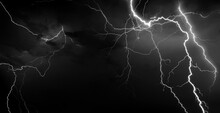 Panorama Dark Cloud At Evening Sky With Thunder Bolt. Heavy Storm Bringing Thunder, Lightnings And Rain In Summer.Black And White Thunderbolt Background.