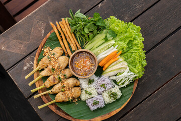 Wall Mural - Vietnamese food named Nem Nướng Gà fresh plater meal food snack on the table copy space food background