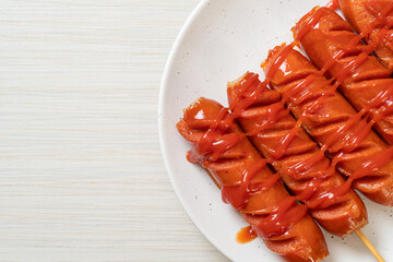 Wall Mural - fried sausage skewer with ketchup