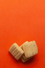 Wall Mural - Stacked Cumin Cookies or Indian Jeera Cookies. On orange background. Top-down view. Food Flat lay.