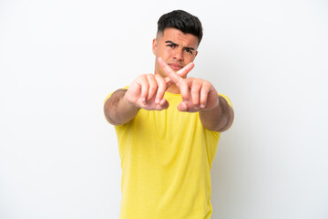 Poster - Young caucasian handsome man isolated on white background making stop gesture with her hand to stop an act