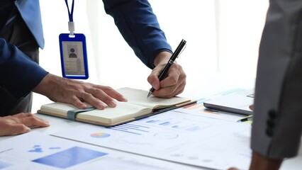 Wall Mural - Finance workers are working together to prepare company financial documents for the meeting with management, together they are checking the accuracy of the information. Financial concept.