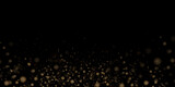 Fototapeta Tęcza - Glittering golden particles of fairy dust on a black background. Christmas sparkling light effect, sparks, glowing lights, sparks and dust and star shine with special light.