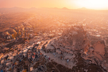 Wall Mural - Uchisar castle at sunrise, Cappadocia Turkey. Aerial top view from drone Nevsehir Province