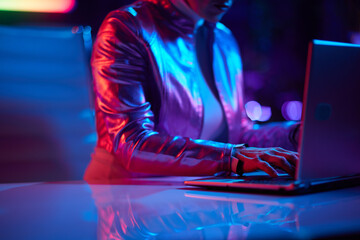 Closeup on woman using laptop in office