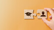© Shutter2U - Hand jigsaw puzzle of people and mortarboard Graduation cap on yellow background. Student getting ready to return to college or arrive for first time in school. Off to University theme.