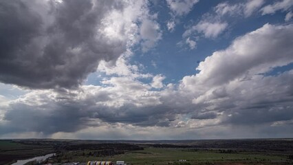 Wall Mural - dark beautiful clouds, dramatic sky over a beautiful valley. the clouds are moving forward. 4k timel