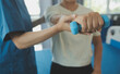 © Sirikarn Rinruesee - Physiotherapist man giving exercise with dumbbell treatment About Arm and Shoulder of athlete male patient Physical therapy concept