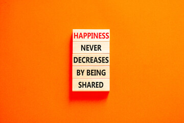 Wall Mural - Happiness symbol. Concept words Happiness never decreases by being shared on wooden block. Beautiful orange table orange background. Motivational Happiness concept. Copy space.