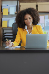 African American businesswoman using laptop computer at office workplace.