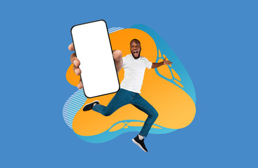 Wall Mural - Excited black guy showing empty smartphone screen while jumping over colorful background