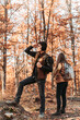 © stivog - Young couple looking at something in the woods. Hiking, outdoors