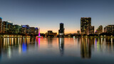Fototapeta Miasta - Orlando city skyline at night. Panoramic view of Orlando in Lake Eola Park, Florida, USA	