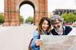 © Xavier Lorenzo - Happy middle aged couple looking a map while sightseeing Barcelona city. Two mature people enjoying summer vacation together in Spain. Retirement and senior lifestyle concept.