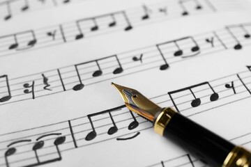 Canvas Print - Sheet with musical notes and fountain pen, closeup view