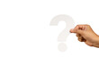 canvas print picture - Hand holding a white question mark symbol against a transparent background