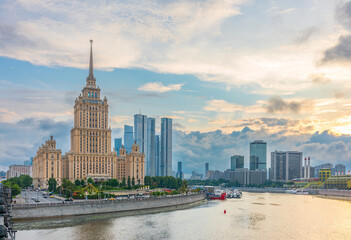 High-rise stalinist building near river at summer sunset in Moscow, Russia. Historic name is Hotel Ukraine.