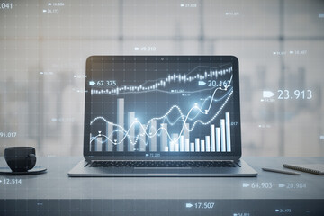 Poster - Close up of laptop computer at workplace with coffee cup and candlestick forex chart or graph on blurry window with city view background. Financial trade market and stock concept. 3D Rendering.