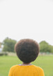 Woman with afro standing in park