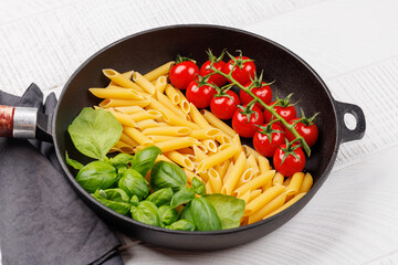 Wall Mural - A vibrant representation of the Italian flag made with pasta, basil, and tomatoes