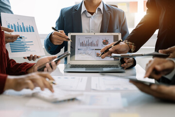 Group of diverse business people discussing a project in a meeting for analysis graph company financial.