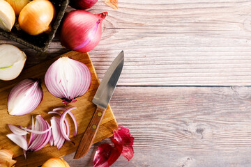 Wall Mural - colorful onions on rustic wooden background.