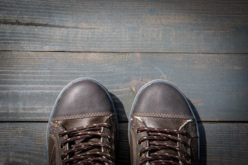 Wall Mural - concept of success and goals. shoes on a wooden texture background