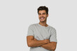 © Asier - Young handsome caucasian man isolated on white background who feels confident, crossing arms with determination.